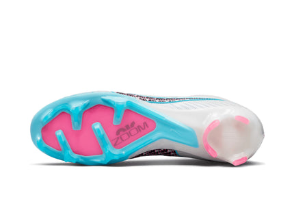 Close-up of a running shoe sole with pink and blue design on a white background