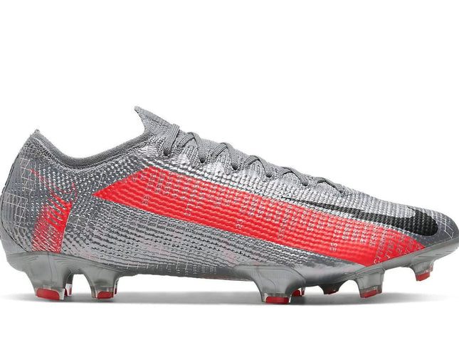 Gray and red soccer cleat on a white background
